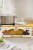 Makaron truflowy Zigante 250 g obok garnka z gotującą się wodą w aranżacji kuchennej