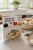 Opakowanie Zigante risotto truflowe 175 g obok miski kremowego risotta